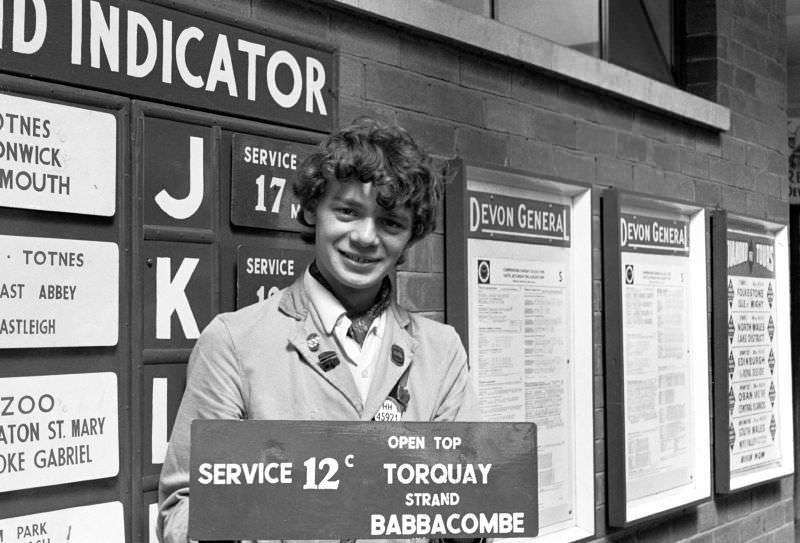War trophy - Devon General indicator board in the hands of a Western National conductor, Paignton bus station, 1970