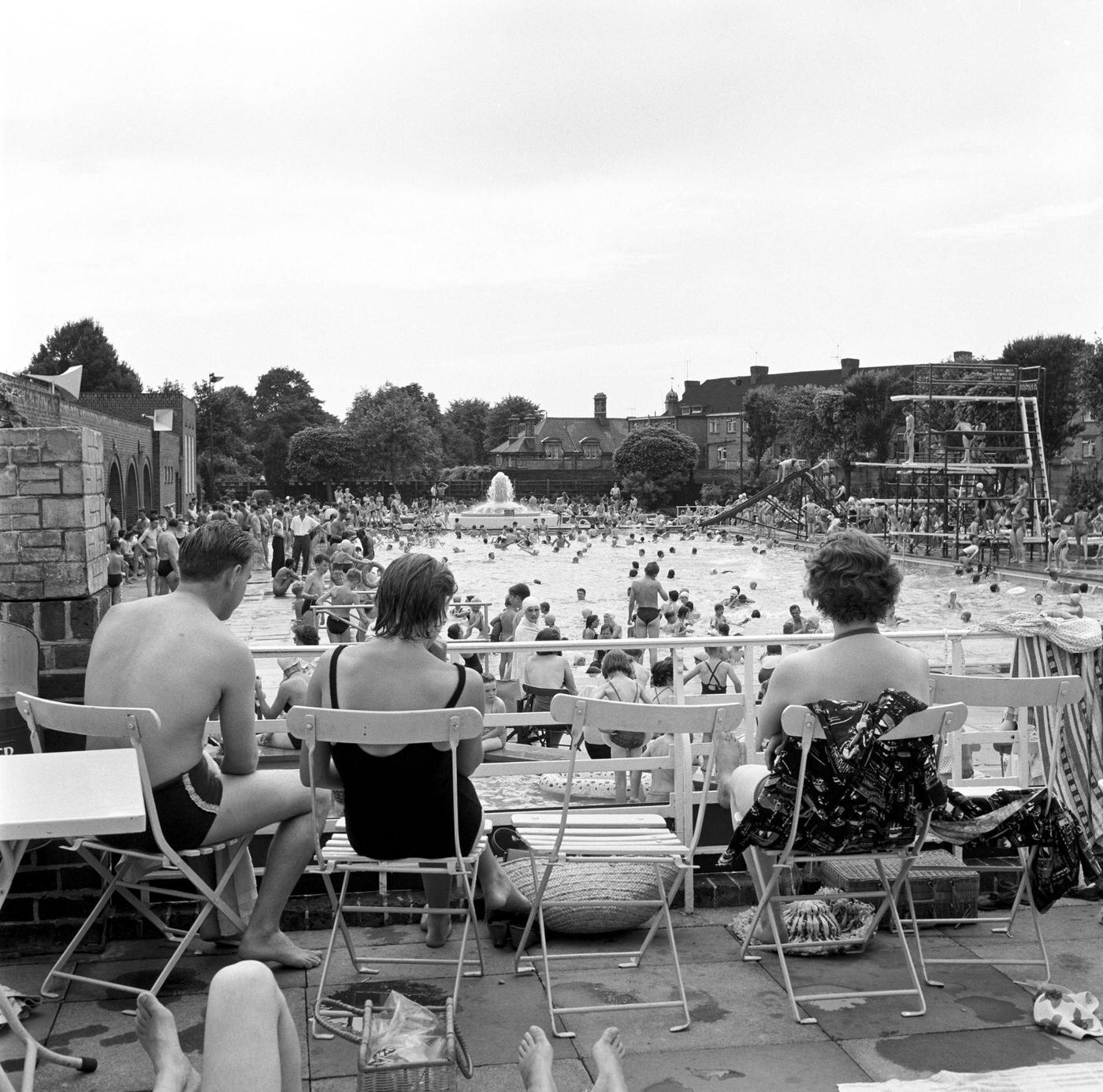 Crowds of sunbathers at the Twickenham outdoor swimming pool, 1960