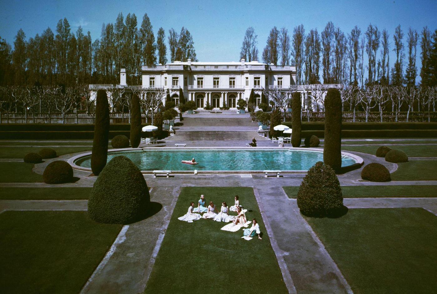 A group of young women enjoying the sunshine in the grounds of the former George Newhall estate in San Francisco, 1960