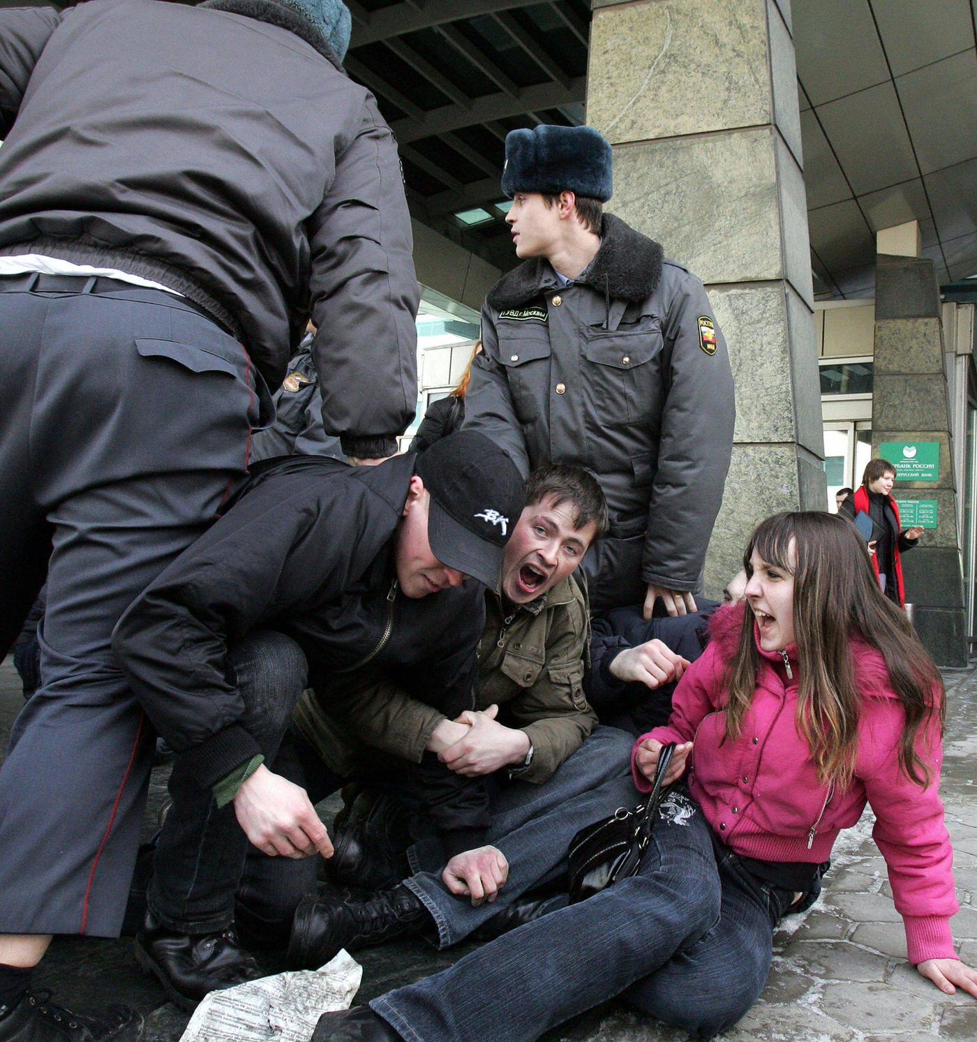 Members of National-Bolshevik Party arrested by Russian police during protest outside "Sberbank" in Moscow demanding compensation for savings lost during Soviet collapse in 1991.