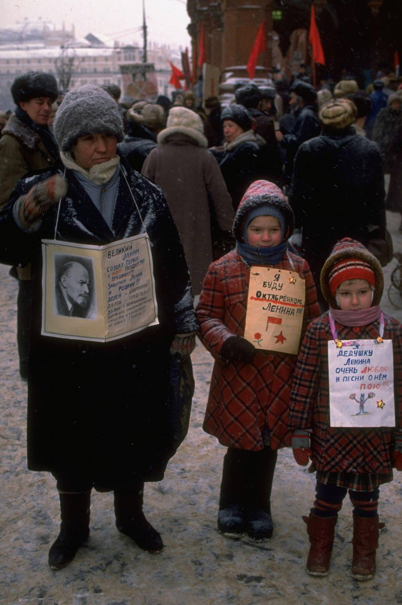 Little girls and woman carrying Lenin picture among diehard demonstrators protesting for return of USSR and Communist Party by Lenin Museum.