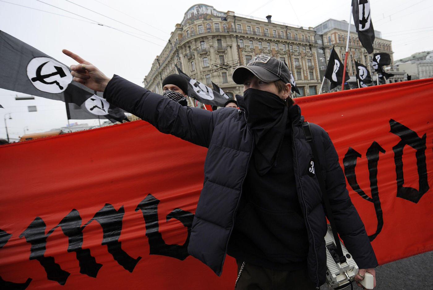 Russian Communist party supporters march in Moscow marking the 92nd anniversary of Communist overthrow of the tsarist empire.