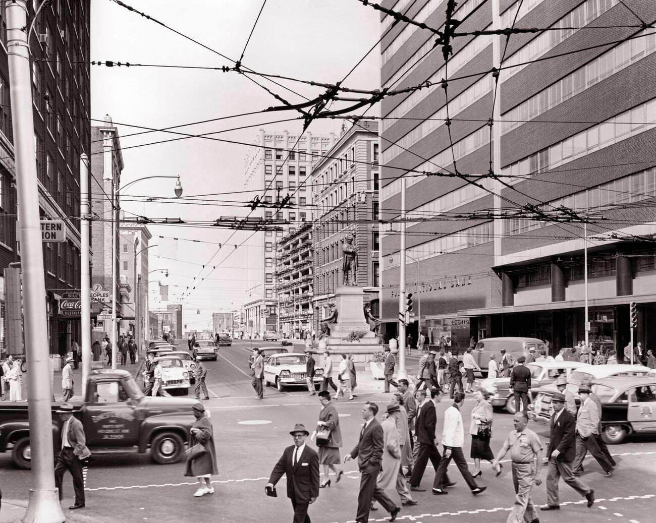 Cityscape Marietta and Forsythia Streets, overhead wires powering trackless trolley electric bus system, Atlanta, 1960s