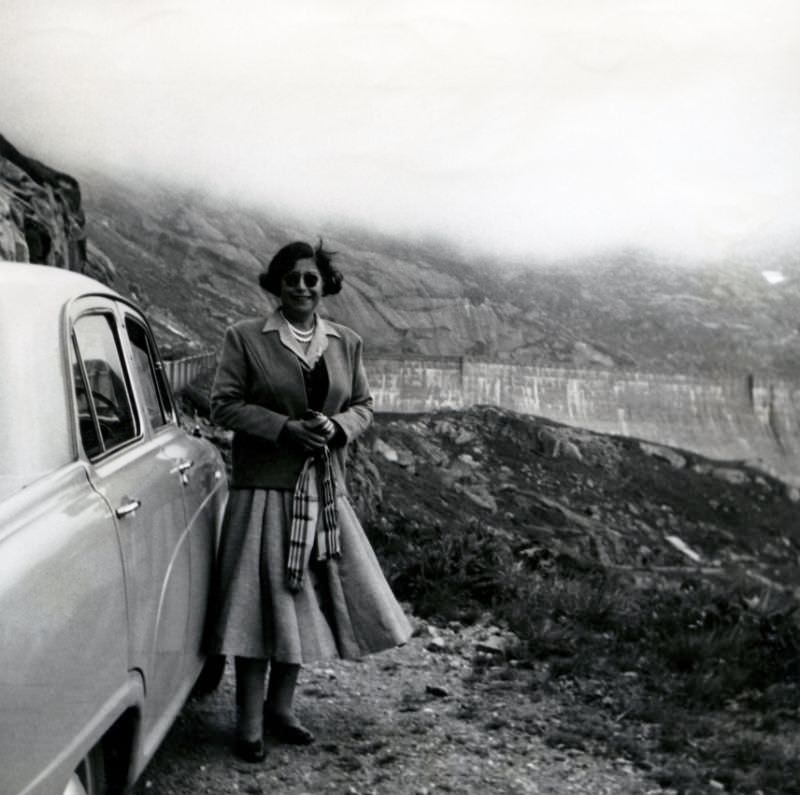Austin parked by the side of an Alpine road, somewhere in Switzerland, August 1955.