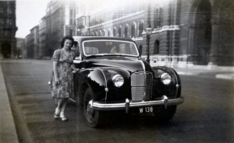 Left-hand drive Austin A70 Hampshire in a city street, registered in the city of Vienna, 1949.