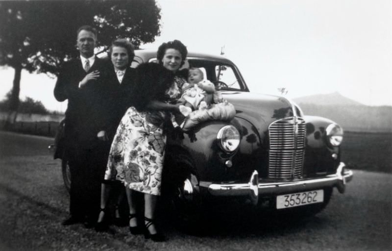 Belgian middle-class family posing with an Austin A40 Devon on the side of a road in the countryside, October 1949.
