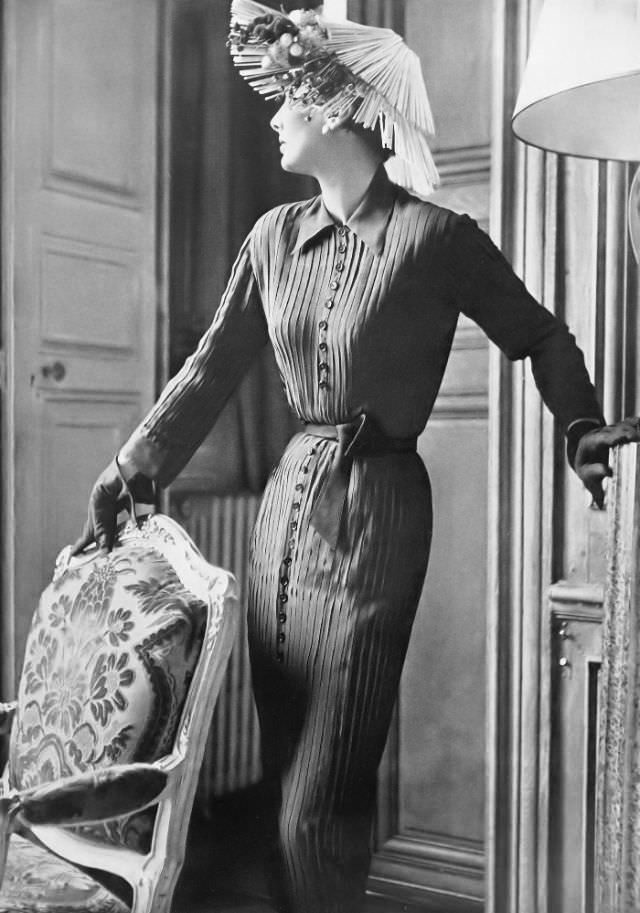 Barbara Goalen in shirtdress of bright navy chiffon with the pleats stitched down by Christian Dior, 1950.