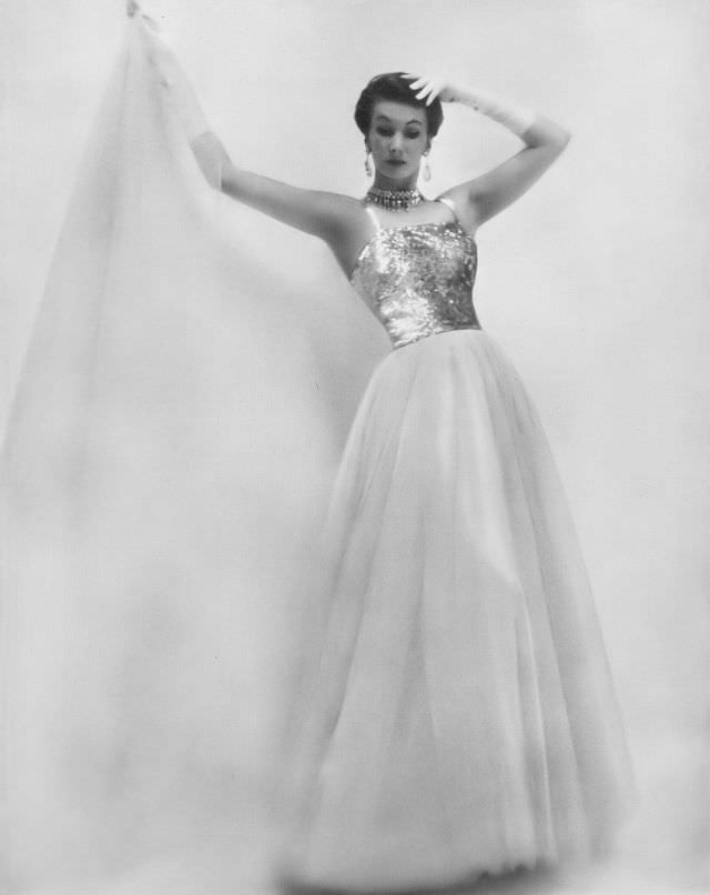 Barbara Goalen in a beautiful tulle evening gown with glittering sequined bodice by Susan Small, 1950.