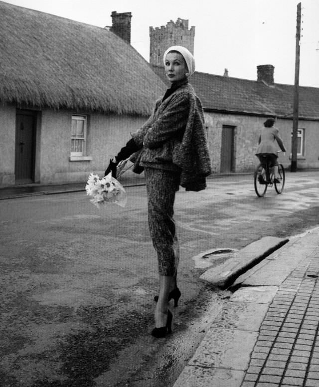 Barbara Goalen in a shaggy woollen suit with sleeveless sling cape by Sybil Connolly, photo by Milton Greene, 1953.