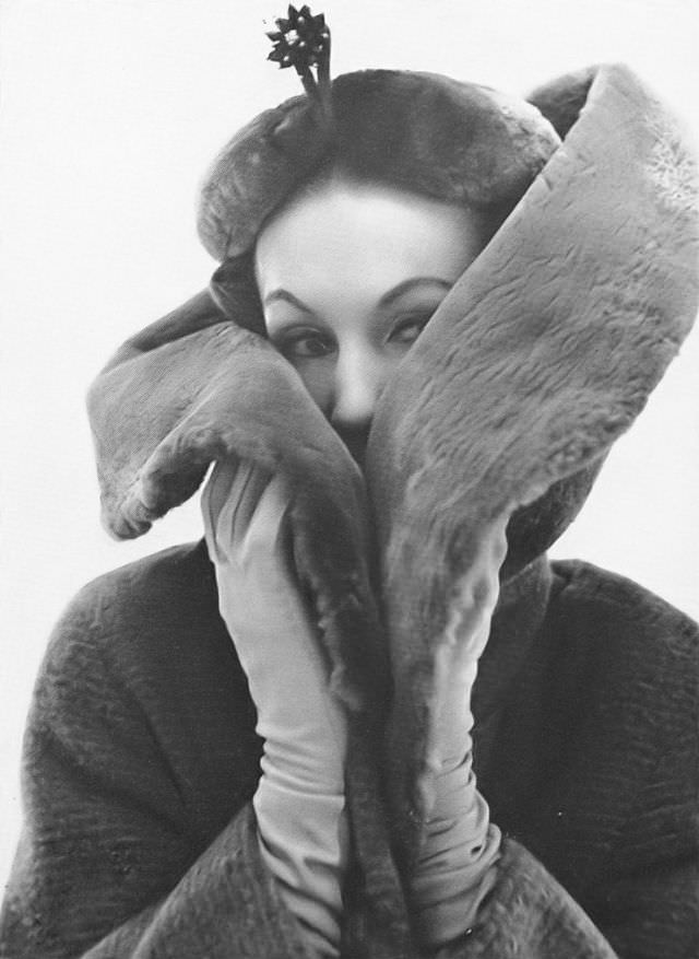Barbara Goalen in wool coat with beaver shawl collar by Sydney Cohen, fur hat by Otto Lucas, 1953.
