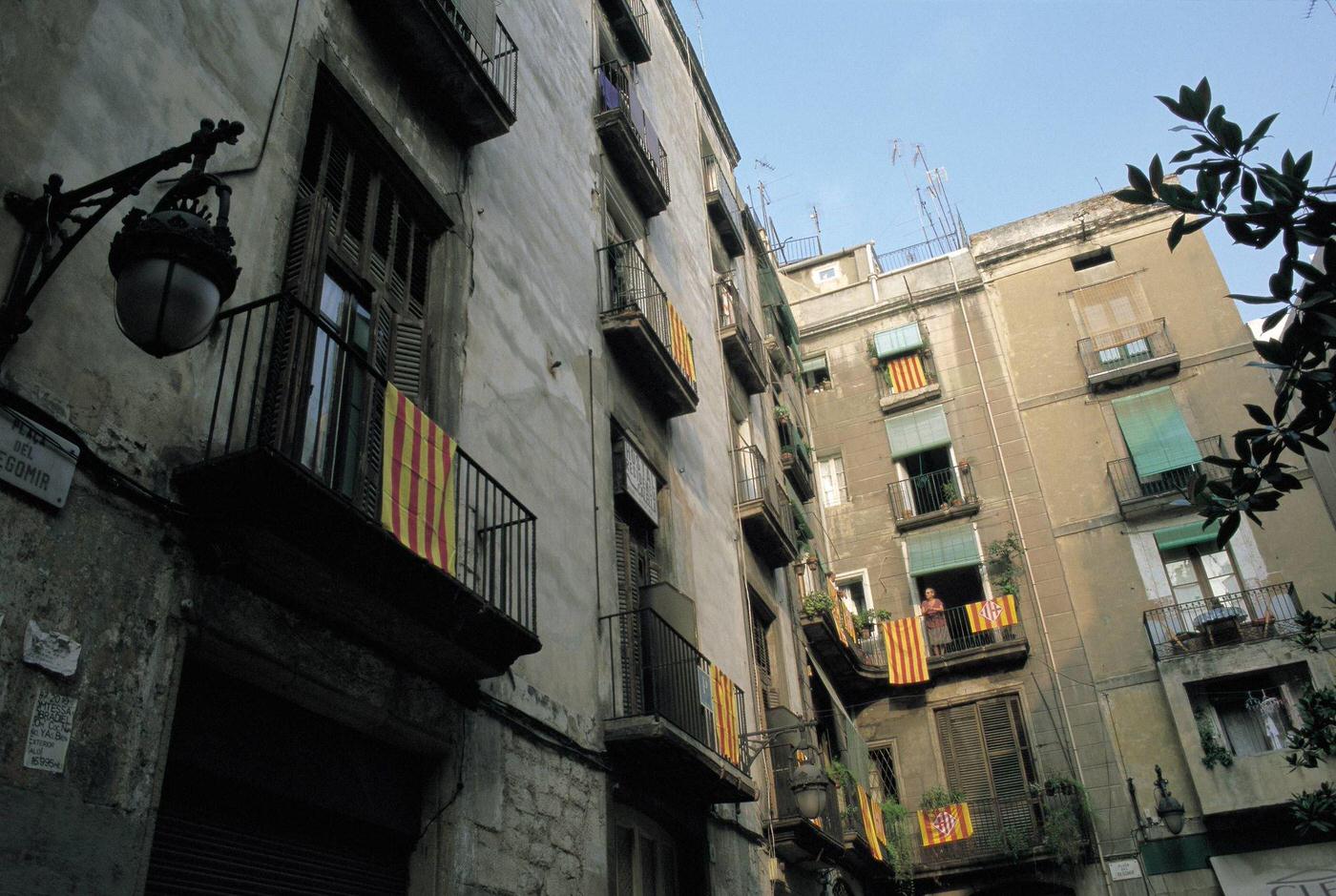 Catalan flags hung on the balconies of Barcelona Catalan flags hung on the balconies in the buildings of Barcelona