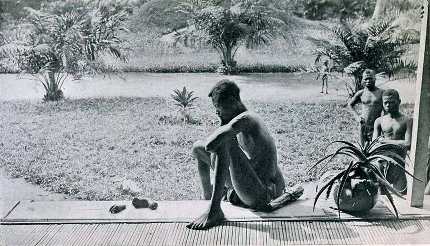 The Face of Colonial Oppression: A Father's Anguish Over His Child's Severed Hands and Feet in the Belgian Congo