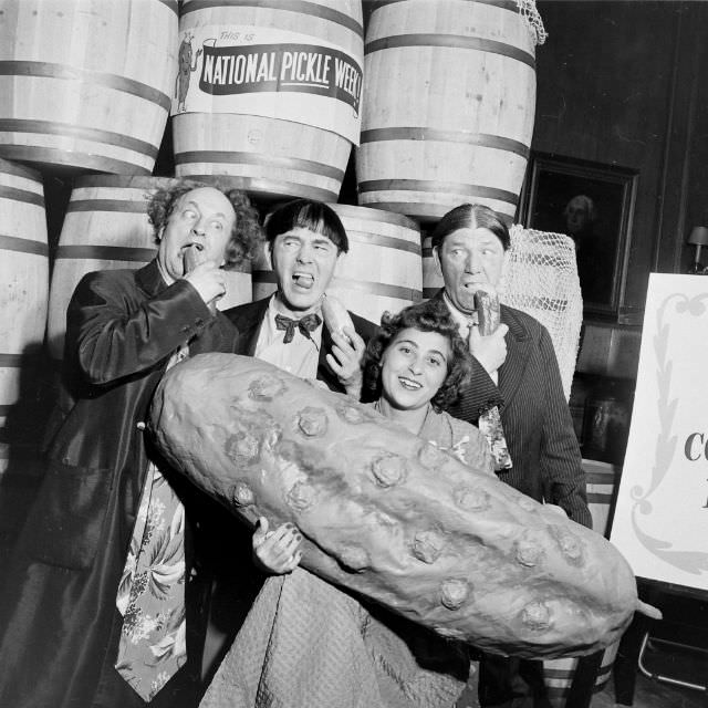 The Pickle Queen posed with the Three Stooges during National Pickle Week, 1949.