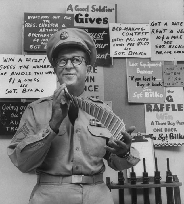 Comedian Phil Silvers, in the character of Sgt. Bilko, shuffling cards on his television show.