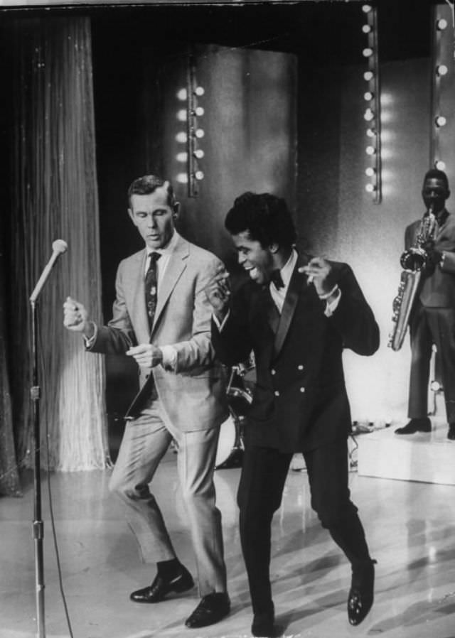 Singer James Brown teaching talk show host Johnny Carson how to dance, 1967.