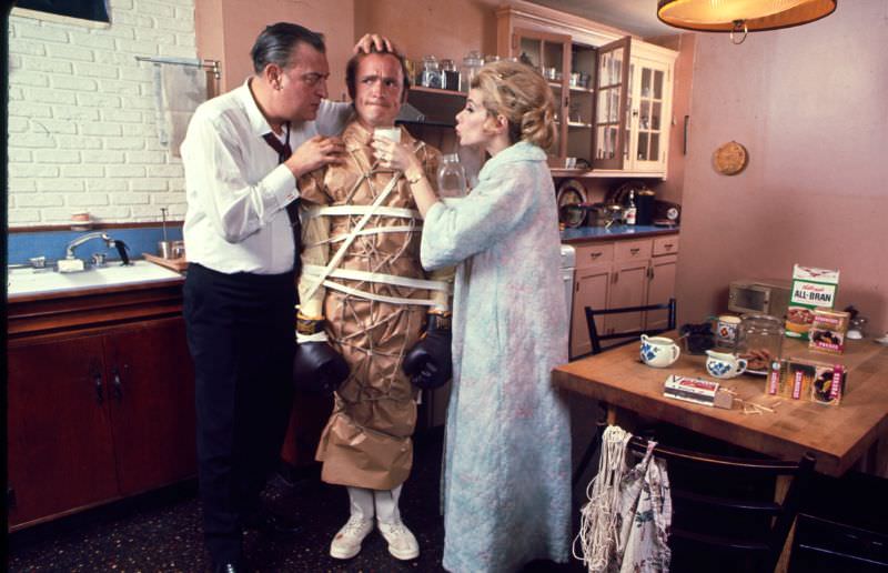 Rodney Dangerfield and Joan Rivers wrapped up Dick Cavett in a scene from Portnoy’s Complaint, 1969.