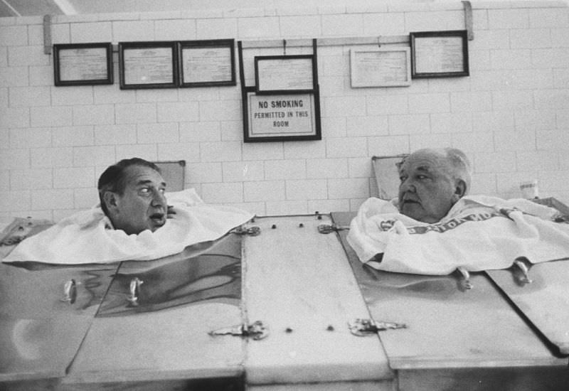 Comedian Henry Youngman (left) in a steam cabinet in Hot Springs, Arkansas, 1960.