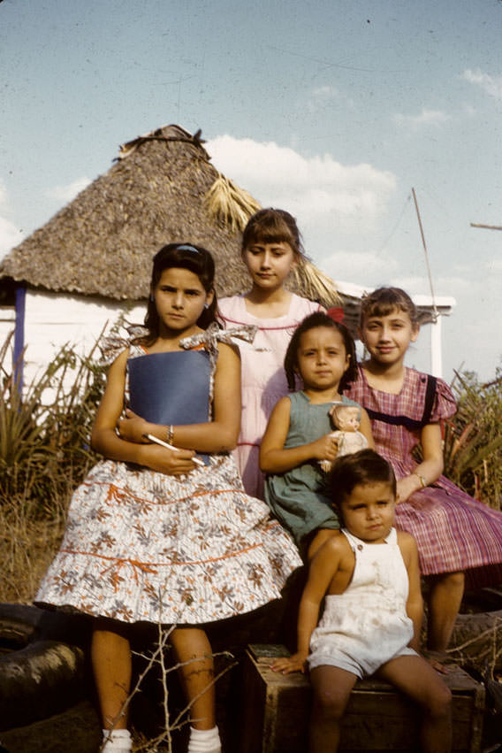 Cuban children seated outdoors