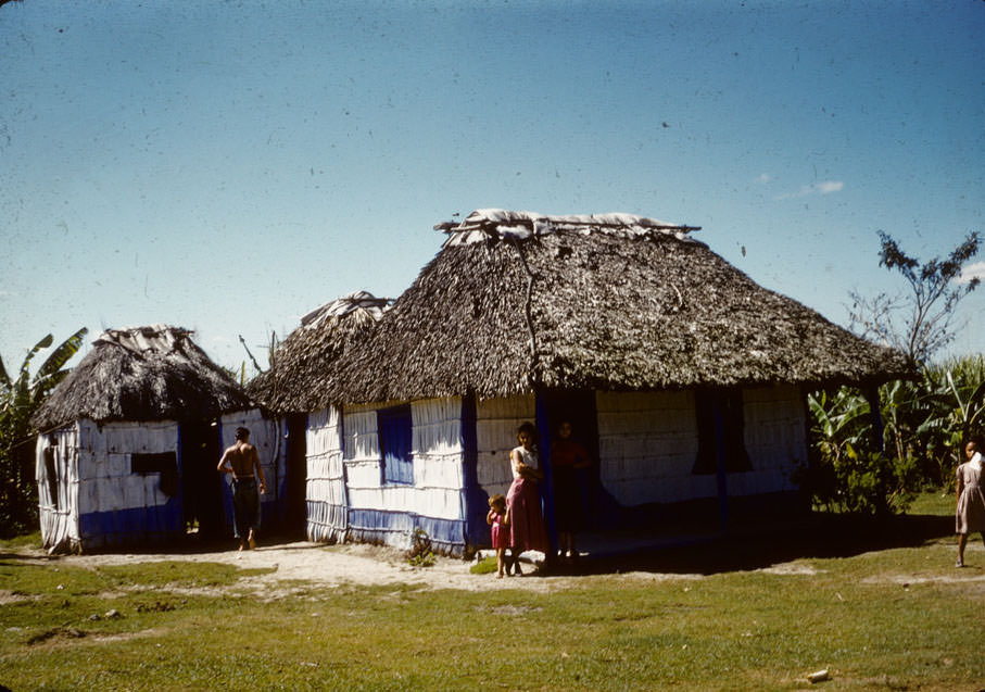 House with thatched roof, painted blue and white