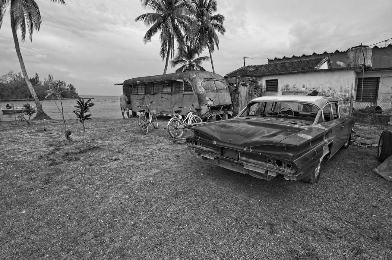 Plot of Land Beside House with Derelict Bus and Old American Car in Caleton, Cuba.