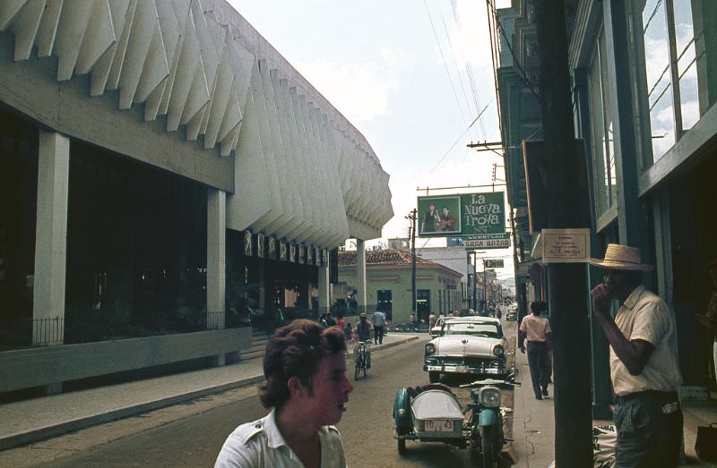 Havana's Coppelia building (left) is one of the largest ice cream parlors in the world. Holding 1000 guests, it is located on the part of Calle 23 known as La Rampa in the Vedado district, 1970s
