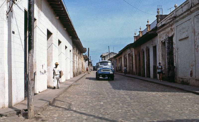 A man walking and old truck, Trinidad, 1976