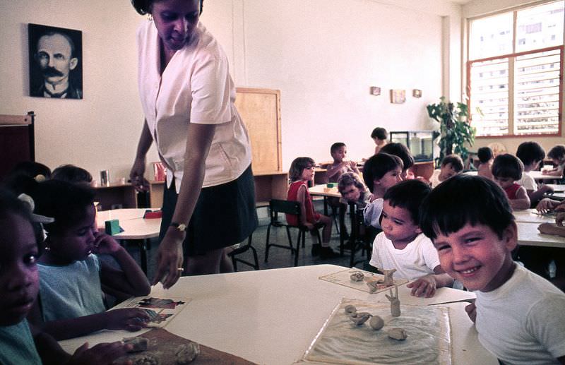 Interior of a school with children doing school work, Cuba, 1976