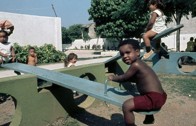 Swinging in the playground of the nursery, Cuba, 1976