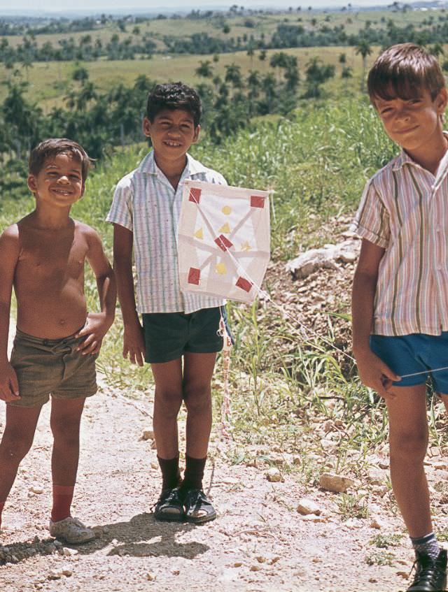 Three boys with a kite, Cuba, 1976