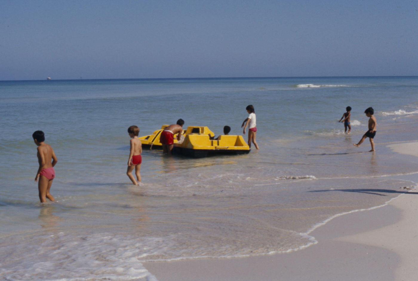 Kids with paddle boat on Varadero Beach, featured in 'Closeup: Cuba - The Castro Generation', Havana, Cuba, 1977.