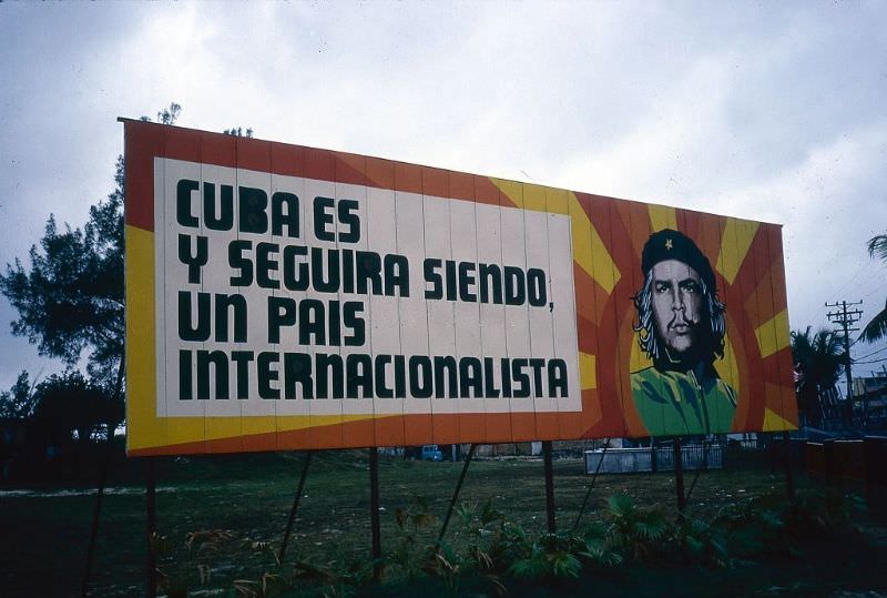 A colorful billboard, which features a portrait of Che Guevara, on the exit road to Jose Marti International Airport, Havana.