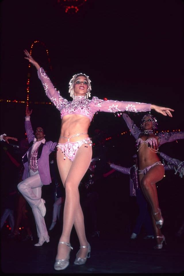 Low-angle view of costumed dancers at the Cabaret Tropicana, Havana.