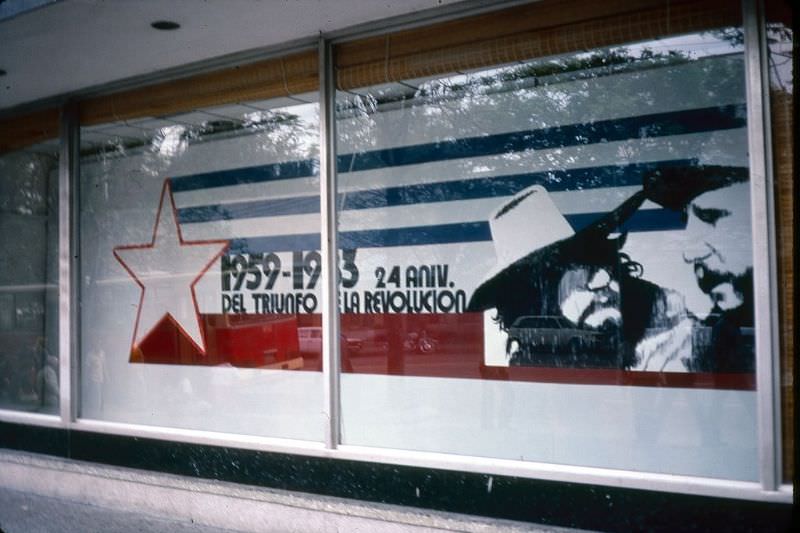 A display, which commemorates the 24th anniversary of the Revolution, in the window of a building (across from the US Interests Section of the Swiss embassy) in the Vedado district, Havana.