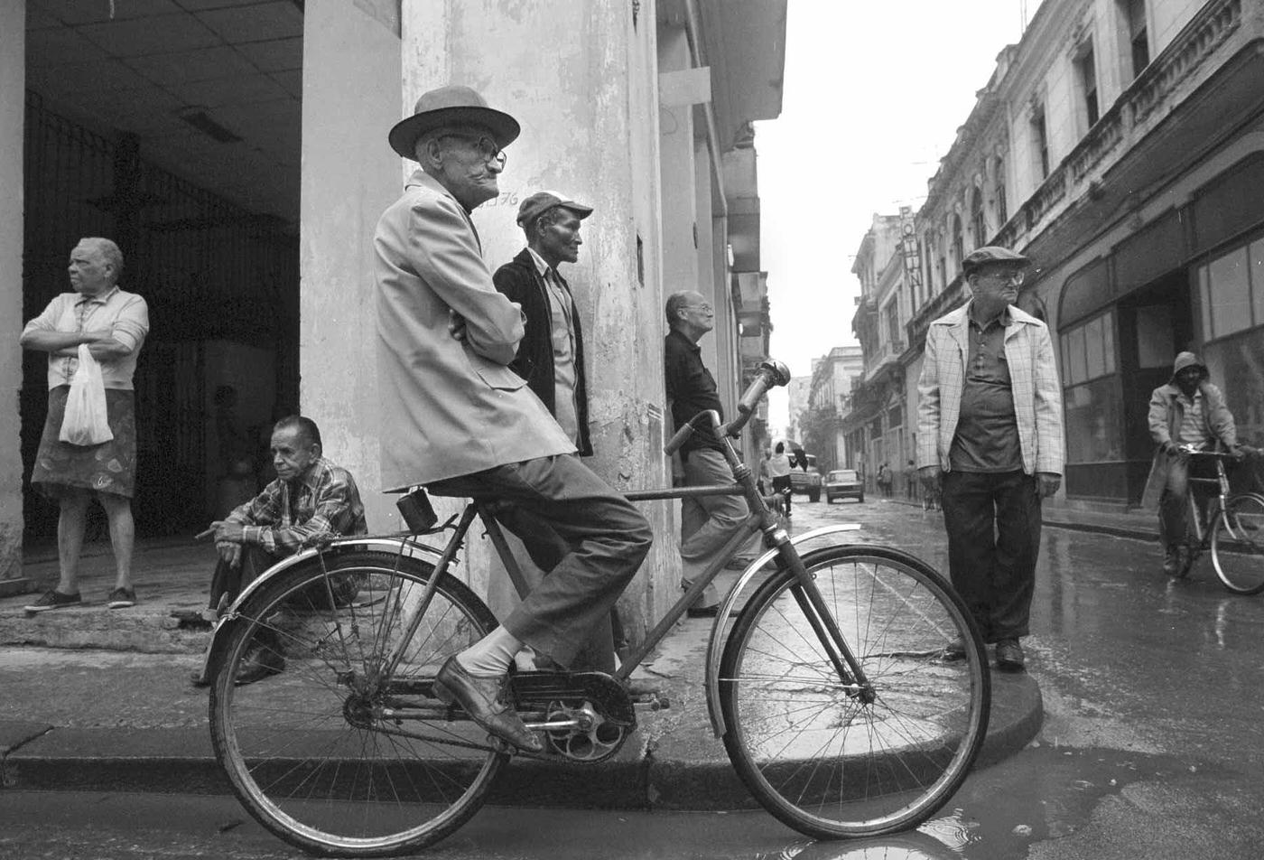 Men congregating on a corner in misty Havana, Cuba, January 27, 1998.