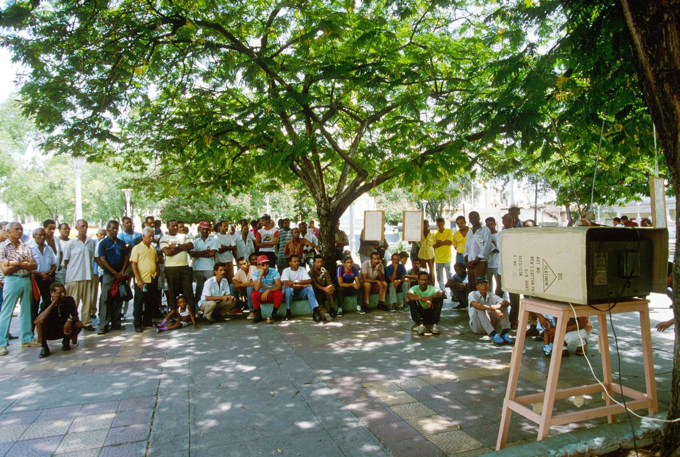 Cuban people watching TV in the street in Santiago de Cuba, 1990.