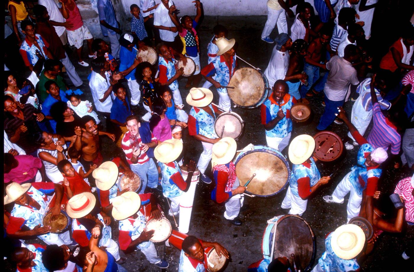 Cuban musicians playing congas during the Carnival party in Santiago de Cuba, 1990s.
