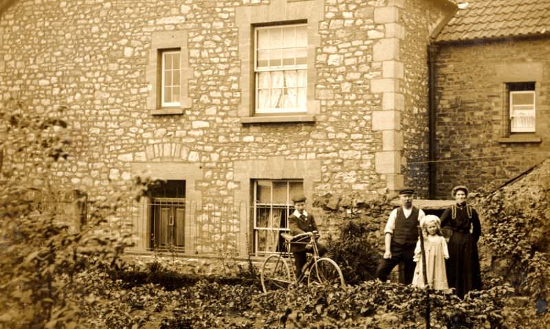 In front of a well pointed stone house