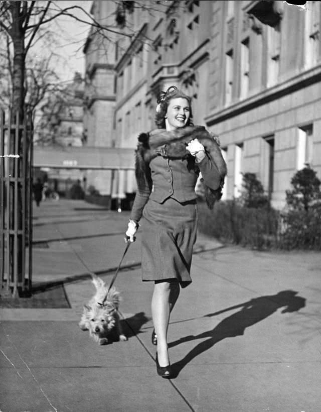 Actress Joan Caulfield briskly walked her West Highland terrier Witty, down Fifth Avenue in New York City, 1944.