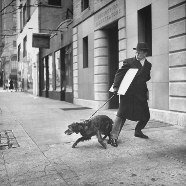 Artist Earle Winslow, with a painting under his arm, struggled to control his stubborn Irish setter, New York City, 1944.