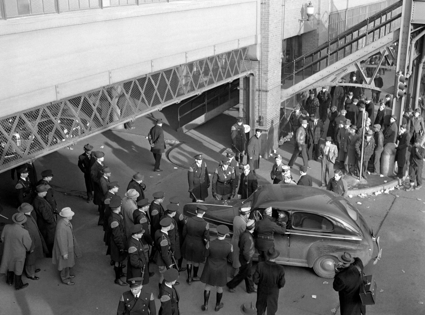 A group of the Michigan state police keep the peace during the Ford Motor Company Labor Strike at the Ford River Rouge complex in Dearborn, Michigan, April 1941.