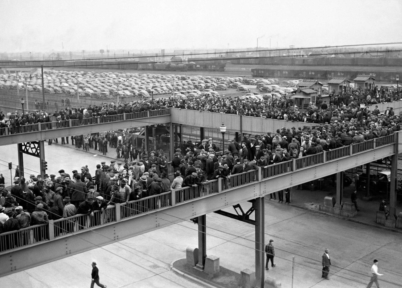 A large crowd of people gather near the Ford Motor Company River Rouge plant during the Detroit Ford Labor Strike in Dearborn, Michigan, April 1941.