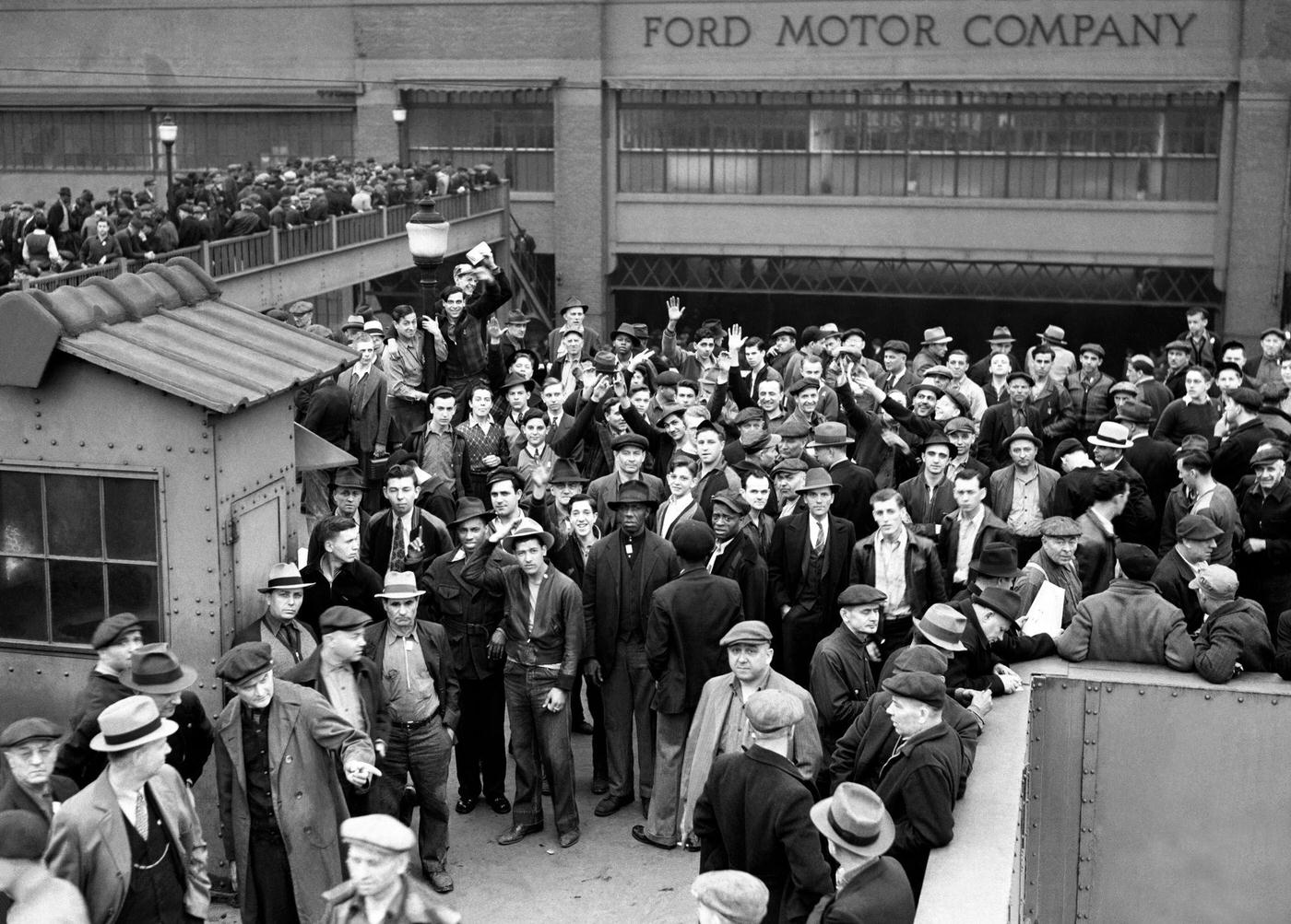 A large crowd of people gather in front of the Ford Motor Company River Rouge plant during the Detroit Ford Labor strike in Dearborn, Michigan, April 1941.