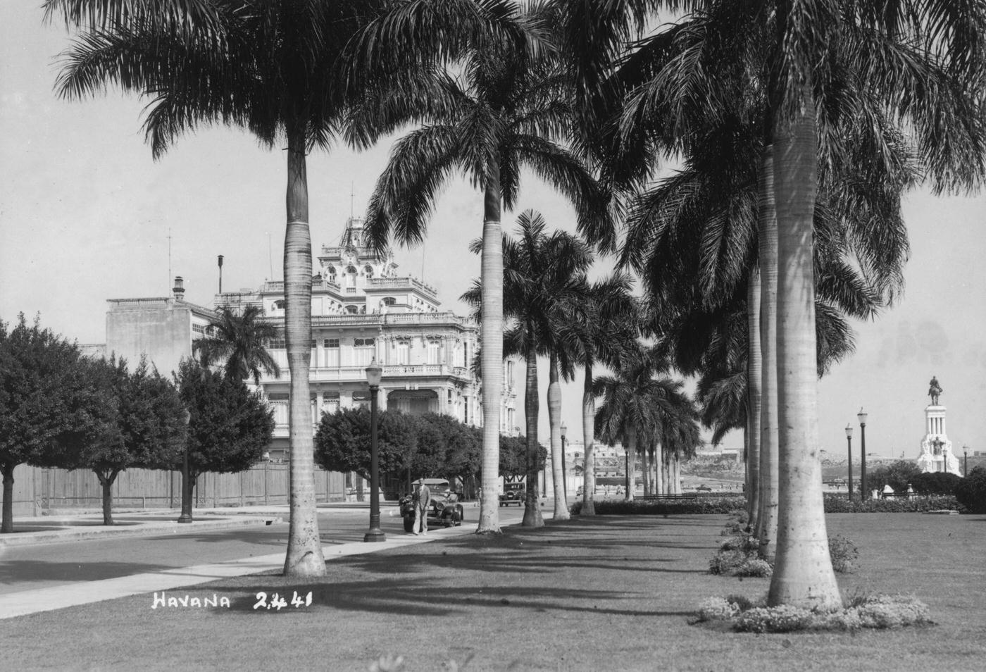Palm trees edge a street in Havana, capital of Cuba, 1938