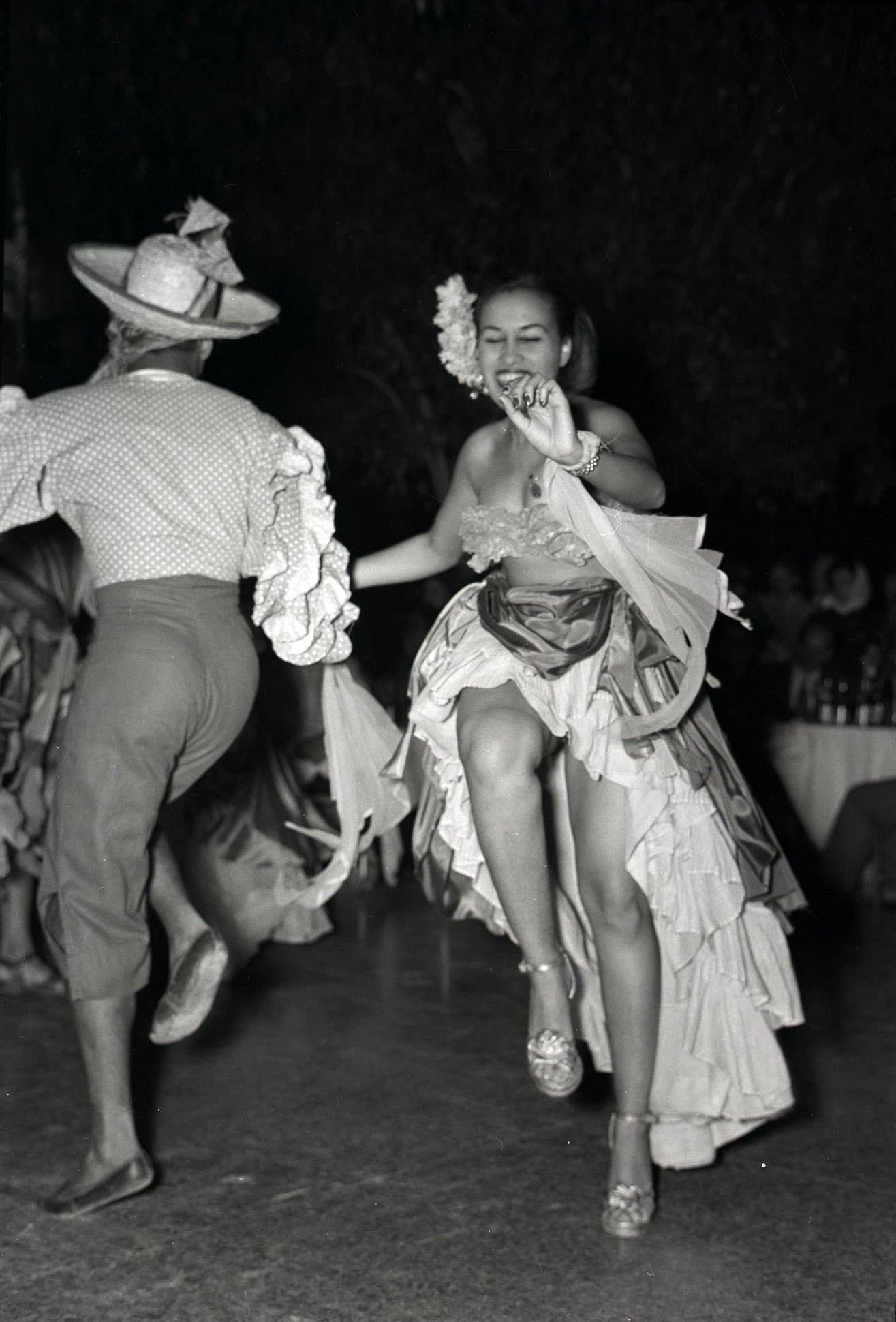 Costumed dancers perform in a floor show at the Tropicana nightclub in Havana, 1930