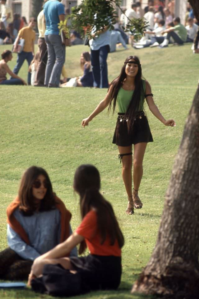 A Southern California high school student walked toward classmates while wearing the “Mini Jupe” skirt, 1969.