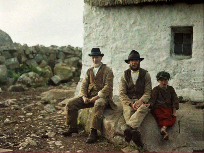 Two skilled fishermen, accompanied by a young apprentice, at work in the waters of An Spidéal, Galway, 31 May 1913