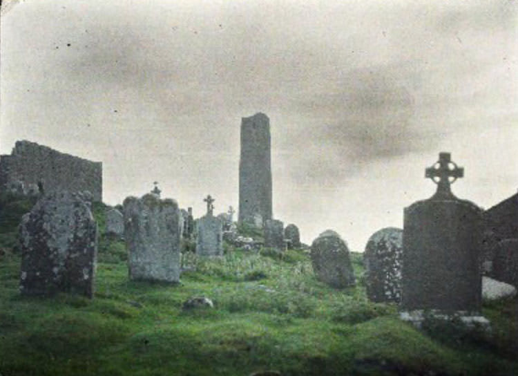 Serene cemetery and majestic round tower in Clonmacnoise, 2 June 1913
