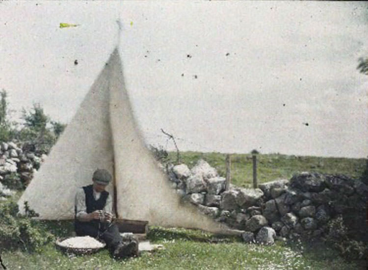 Skilled eel fisherman plying his trade on the tranquil waters of Lough Ree, Athlone, June 1913