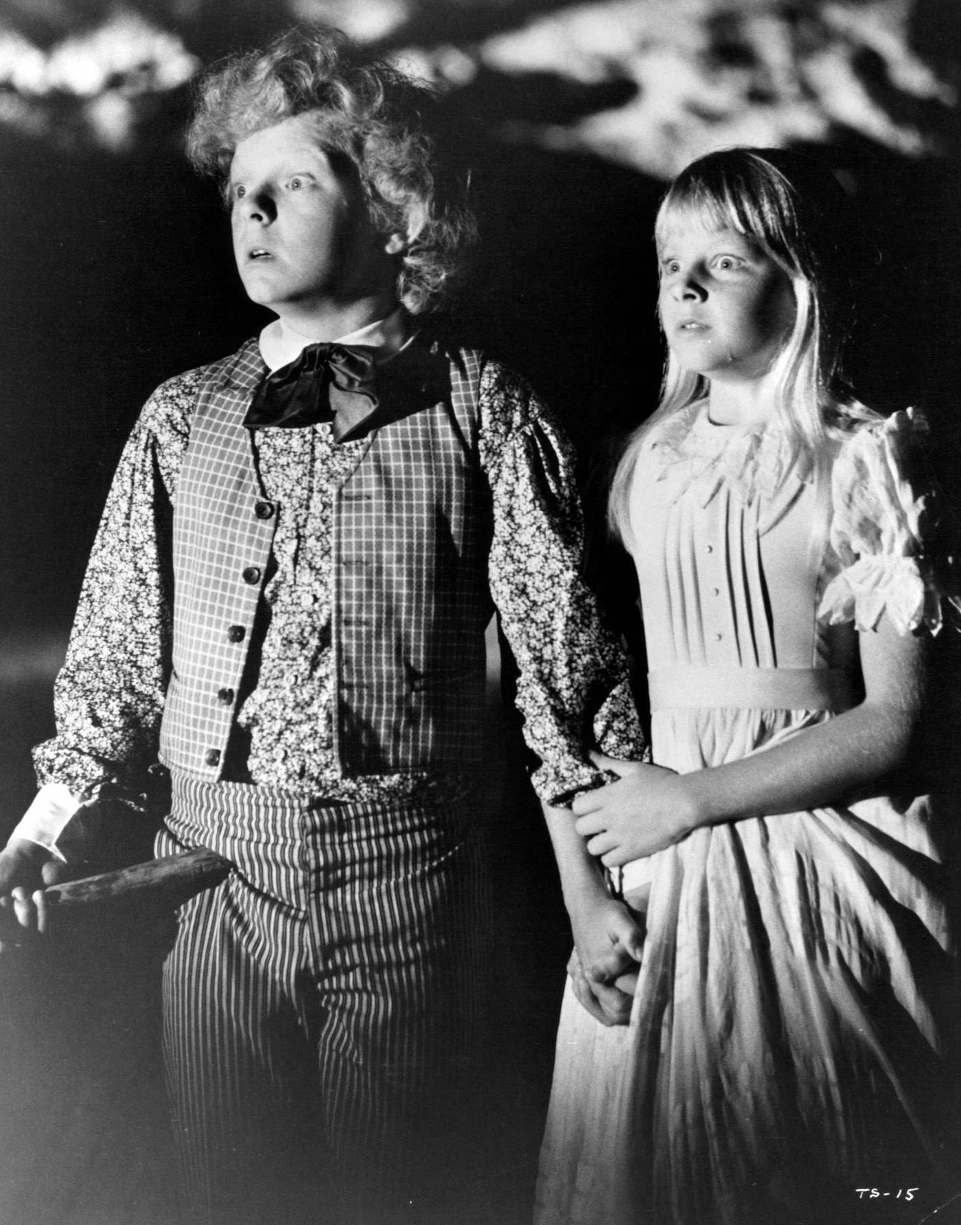 Johnny Whitaker and Jodie Foster with stunned looks in 'Tom Sawyer', 1973.