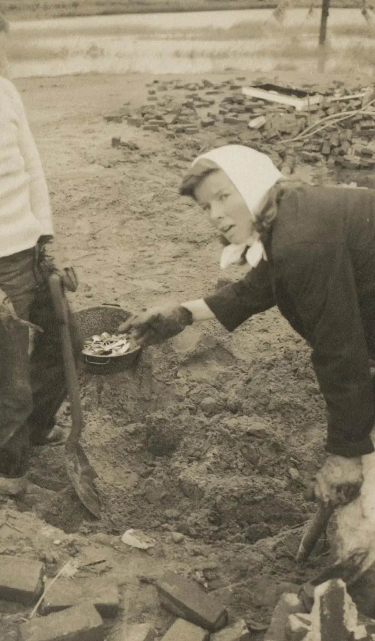 Katharine Hepburn digging through the debris of her home after the 1938 hurricane.